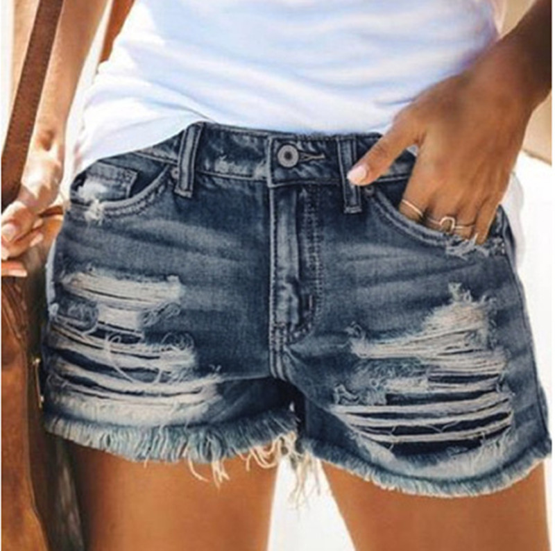 Short denim déchiré franges femme
