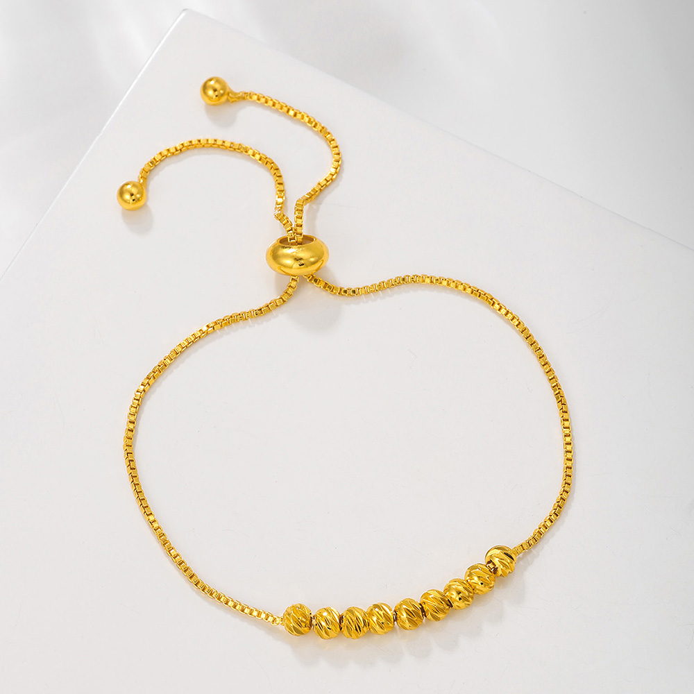 Bracelet perles fleur cordon doré porte-bonheur