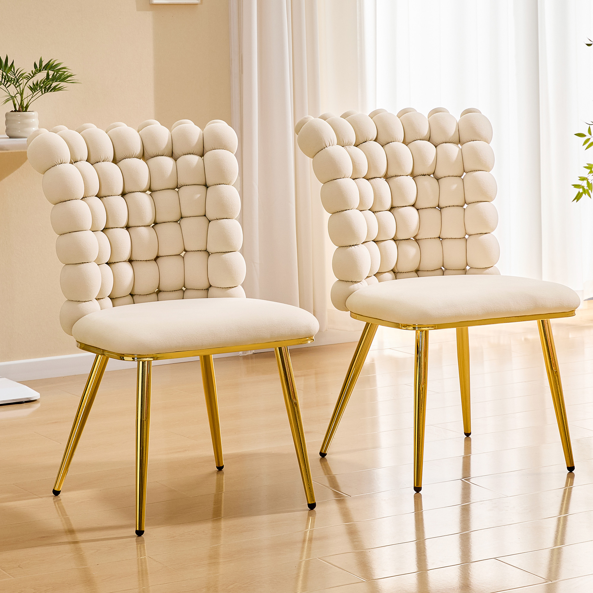 Lot 2 fauteuils pivotants capitonnés velours or