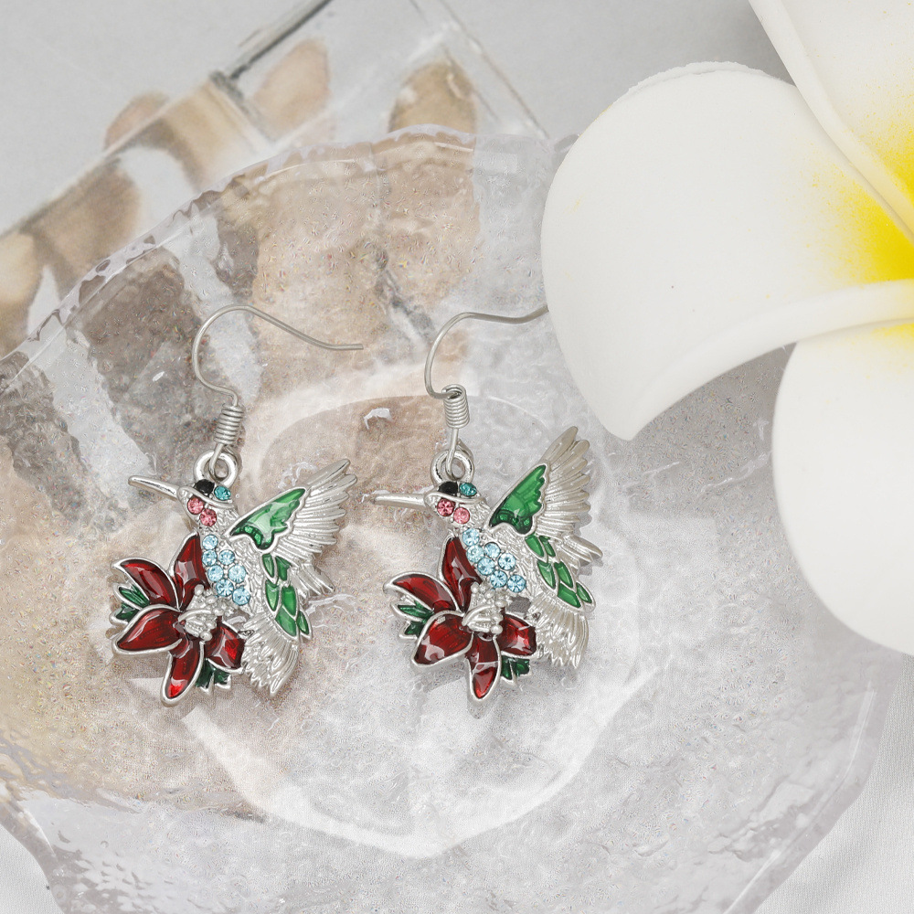 Boucles oreilles pendantes colibri diamants