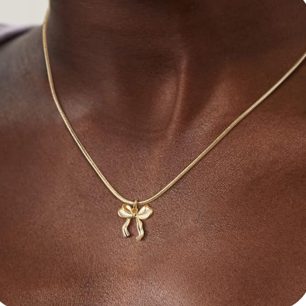 Collier nœud chaîne clavicule doré femme