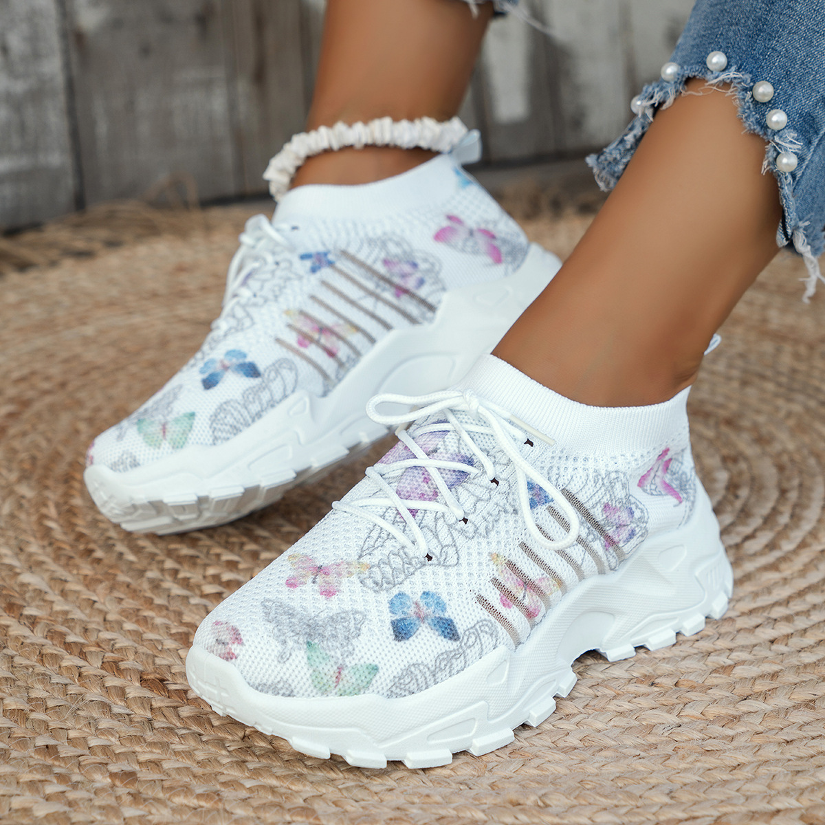 Sneakers mesh papillon talon plat femme