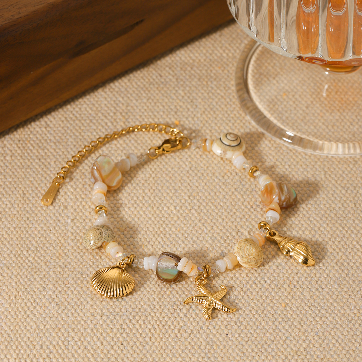 Bracelet acier inoxydable coquillage conque étoile de mer femme